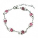 Bracelet fantaisie aspect argenté aux faux cristaux roses